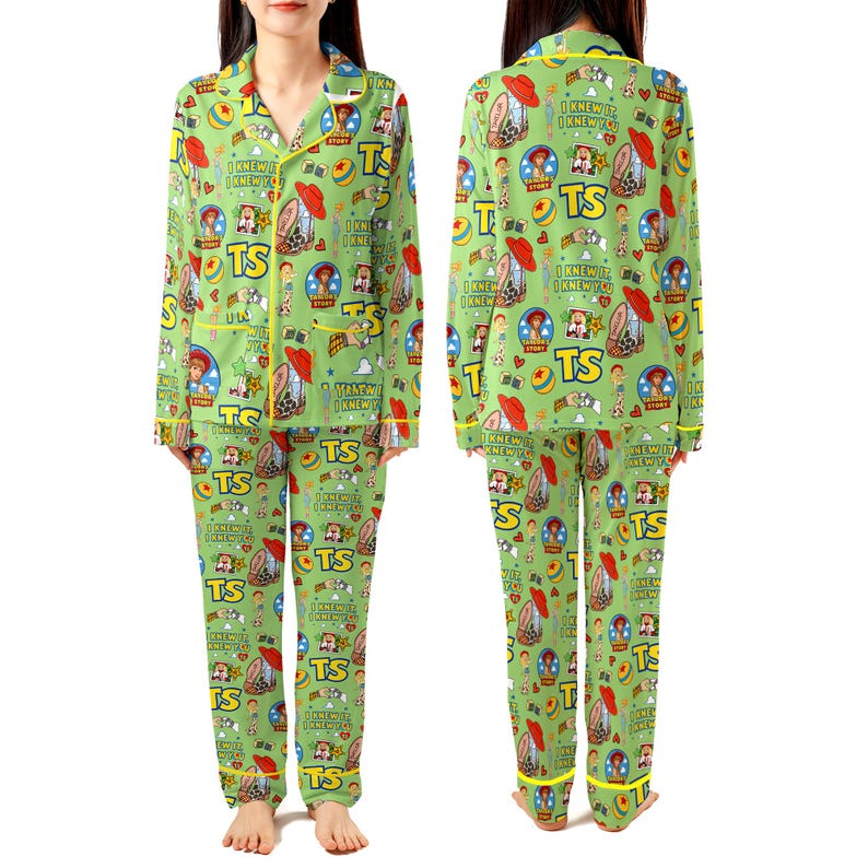 May include: A light green pajama set featuring a repeating pattern of Toy Story characters, red hats, yellow balls, and the text "TS" and "I KNEW IT, I KNEW YOU". The long-sleeved button-down top and matching long pants have bright yellow piping trim.