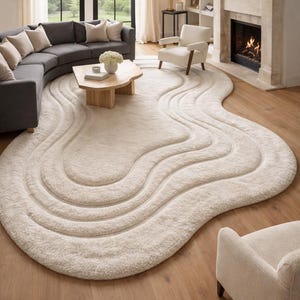 Handgemaakt getuft wollen vloerkleed, onregelmatige wolkvorm, crèmebeige abstract tapijt