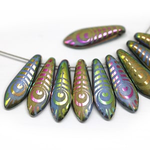May include: A strand of iridescent glass beads with a teardrop shape and a swirling pattern. The beads are dark green, blue, and gold with a rainbow sheen.