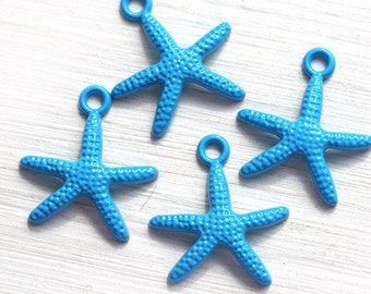 May include: Four blue metal starfish charms with a hole at the top for hanging. The starfish are all the same size and have a textured surface.