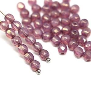 Cuentas redondas de cristal checo facetadas de 4 mm, color rosa oscuro, con brillo dorado y pulido al fuego (50 unidades) - 5063