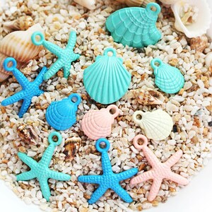 May include: Assortment of colorful seashell charms in various shapes, including starfish, seashells, and clams. The charms are made of metal and have a shiny finish. They are perfect for adding a touch of beachy style to jewelry, crafts, and other projects.