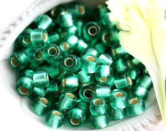 TOHO Saatperlen, Größe 6/0, Silber Gefüttert Frosted Dark Peridot, N 24BF, grüne runde japanische Glasperlen - 10g - S374