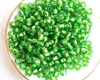 Grüne Toho-Rocailles 11/0, Peridot mit Silbereinzug, N 27, japanische Rocailles - 10g - S146