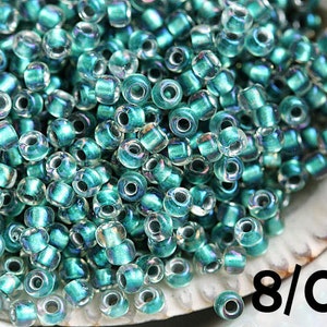 Toho Teal Rocailles 3/0: Regenbogen Crystal Lined Rocaille Perlen (10g)