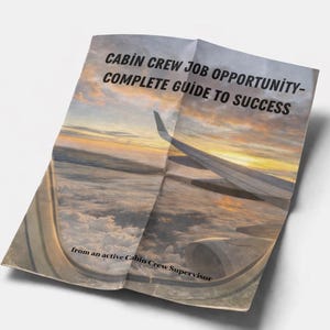 May include: A folded paper with the text "CABIN CREW JOB OPPORTUNITY - COMPLETE GUIDE TO SUCCESS" against a backdrop of a sunset view from an airplane window. The text "From an active Cabin Crew Supervisor" is also visible.