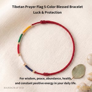 May include: Red cord bracelet with five colored segments: yellow, green, red, white, and blue. Gold-colored beads separate the colors. Text on the image reads "Tibetan Prayer Flag 5-Color Blessed Bracelet" and "Luck & Protection."