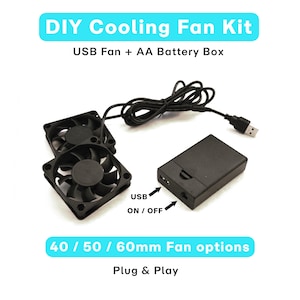 May include: A DIY cooling fan kit featuring two black fans, a USB cable, and a black AA battery box. The kit offers fan options of 40, 50, or 60mm. The image text says "DIY Cooling Fan Kit" and "Plug & Play".