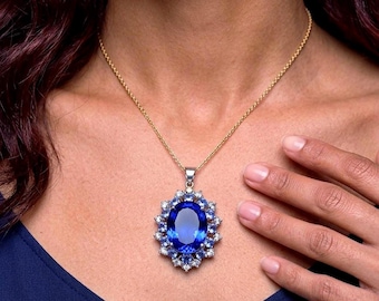 Colgante de plata de ley con halo de tanzanita y aguamarina. Cadena de acero ajustable. Caja de regalo incluida.