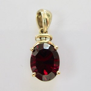 Vintage 9ct Gold Oval Garnet and Diamond in a Heart Mount Pendant