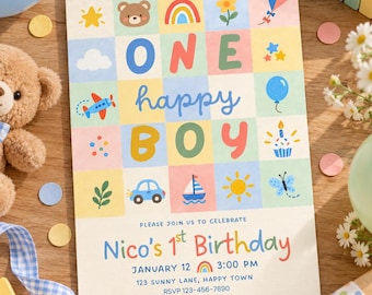May include: A rectangular birthday invitation card featuring a grid of pastel-colored squares with icons of a bear, rainbow, flower, kite, airplane, balloon, cupcake, car, sailboat, and sun. The text reads ONE happy BOY, Nico's 1st Birthday, January 12, 3:00 PM, 123 SUNNY LANE, HAPPY TOWN, RSVP 123-456-7890.