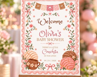 May include: A rectangular baby shower welcome sign featuring a scalloped pink border, floral vines, and papel picado bunting. The text reads Welcome to Olivia's BABY SHOWER, THERE'S A LITTLE Conchita IN THE OVEN, and the date 06 | 01 | 202X.