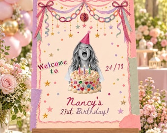 May include: A rectangular birthday sign on an easel featuring a black and white photo of a person in a party hat holding a cake with candles. The sign includes the text Welcome to, 24/10, and Nancy's 21st Birthday, decorated with pink bows, stars, and confetti.