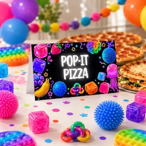 May include: A rectangular sign with a black background featuring the white text POP-IT PIZZA surrounded by colorful illustrations of sensory toys, including cubes, spheres, a banana, a strawberry, and a jellyfish, with confetti scattered around.