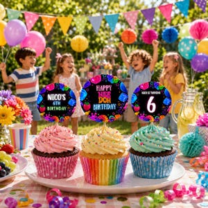 May include: Three cupcakes in rainbow-striped paper liners topped with colorful frosting and round toppers. The toppers feature black backgrounds with neon-colored graphics and text reading 'Nico's 6th Birthday', 'Happy Nee Doh Birthday', and 'Nico is turning 6'.