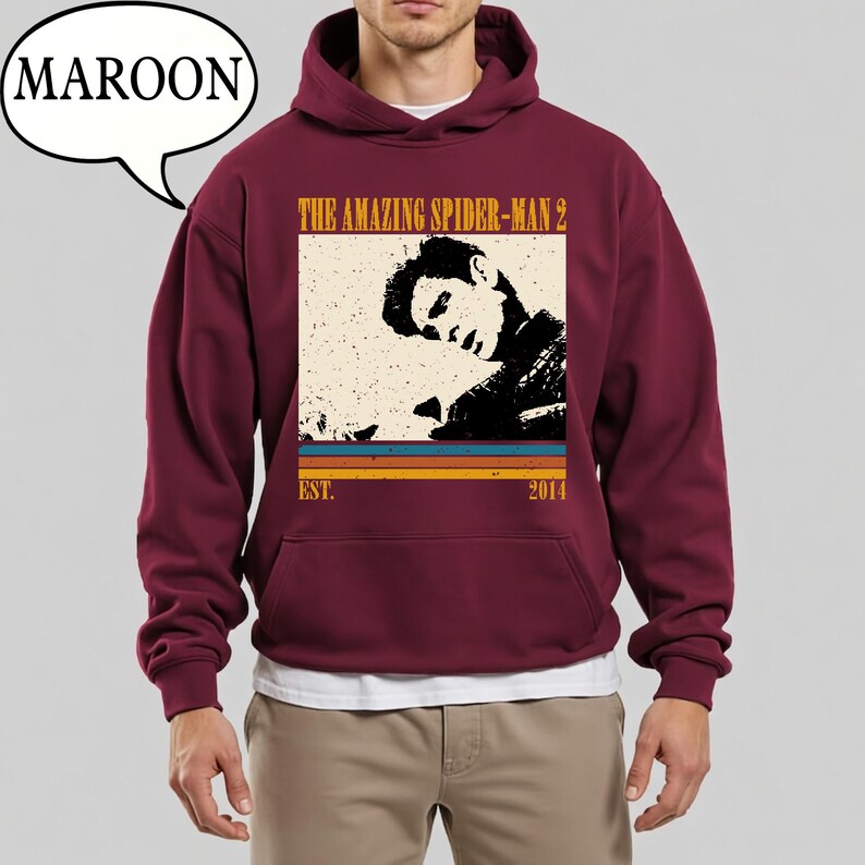 May include: Maroon hoodie with a graphic from "The Amazing Spider-Man 2" in a retro style. The design includes a black and white image, the film title, and the year 2014. The hoodie has a front pocket and a hood.