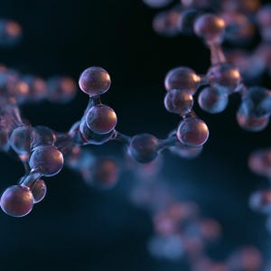 Könnte beinhalten: Ein molekulares Strukturmodell mit durchscheinenden violetten Kugeln, die durch dünne Stäbe verbunden sind und ein komplexes dreidimensionales Netzwerk vor einem dunklen, unscharfen Hintergrund mit blauen und violetten Lichtreflexen bilden.
