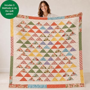 May include: A quilt featuring a repeating triangle pattern in various colors including orange, yellow, green, blue, and floral prints on a cream background. The quilt has a border of floral and plaid fabric and includes text: Includes 3 Methods to do the quilt pattern.