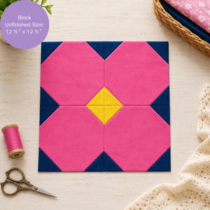 May include: A square quilt block featuring a central yellow diamond surrounded by four large pink octagonal shapes and dark blue corner triangles. The block has an unfinished size of 31.75 cm by 31.75 cm as indicated by the text.