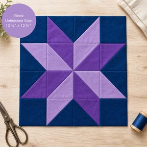 May include: A square quilt block with a star design in shades of purple and navy blue. The block measures 12.5 inches by 12.5 inches. The text "Block Unfinished Size: 12 1/2" x 12 1/2"" is in a purple circle.