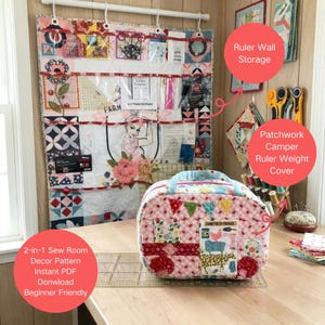 May include: A patchwork sewing room organizer with pockets and a matching camper-shaped ruler weight cover. The organizer features various fabric patterns and a vintage-style illustration. The text on the organizer reads "FARM FRESH PRODUCE".