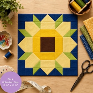 May include: A square quilt block featuring a central dark brown square surrounded by yellow and light yellow petals, accented with lime green triangles, all set against a deep navy blue background, with a label stating an unfinished size of 12.5 x 12.5 inches.