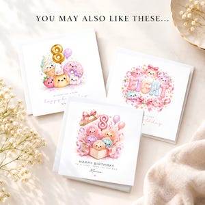 May include: Three square white greeting cards featuring colorful watercolor illustrations of smiling food characters, balloons, and the number eight. The text includes "HAPPY BIRTHDAY TO A VERY SPECIAL FRIEND" and "Marnie" on the bottom card.