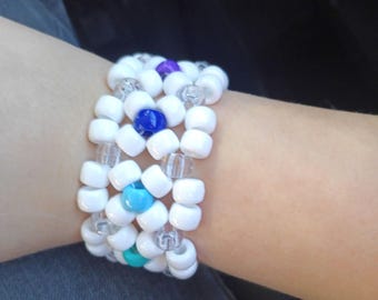 White X Base With Center Rainbow Bead