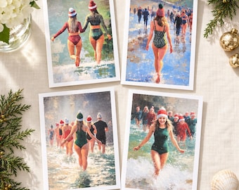May include: Four rectangular greeting cards featuring impressionistic scenes of people in swimsuits and winter hats wading into water. The images depict groups of individuals in various swimwear, including one-piece suits and bikinis, wearing red and white pom-pom hats while walking or running through surf.