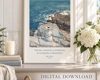 May include: A framed art print featuring a painting of a person in a white dress and hat sitting on rocky cliffs overlooking a blue sea. Below the image, the text reads: THE SEA, DANCING & SPARKLING IN SUNSHINE & FRESHNESS. Jane Austen, Sanditon.