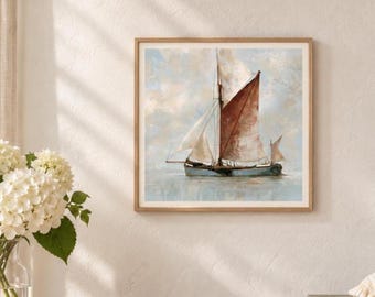 May include: A square framed wall art print depicting a sailboat with reddish-brown and white sails on a calm, light blue sea under a soft, cloudy sky. The vessel features a dark hull and is rendered in a painterly style with visible brushstrokes.