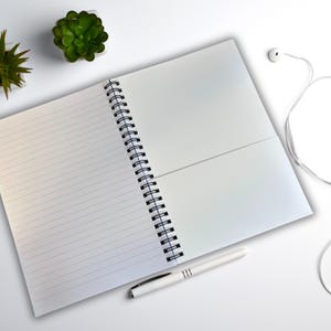 Spiral-bound sea-inspired journal with lined paper for reflective writing, ideal for wild swimmers.
