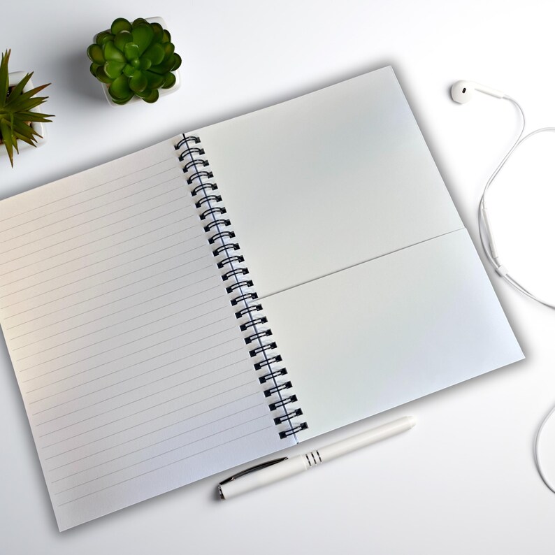 Spiral-bound sea-inspired journal with lined paper for reflective writing, ideal for wild swimmers.