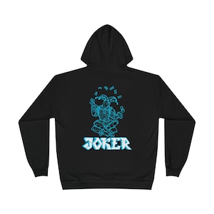 May include: Black hoodie featuring a teal graphic of a jester juggling cards, with the word "JOKER" below. The jester is in a seated position. The hoodie has a hood and long sleeves.