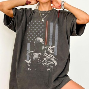 May include: A set of three ceramic mugs with a speckled, matte finish. The mugs are in shades of cream, light gray, and dark gray. Each mug has a simple, modern design and a rounded handle. The mugs are stacked on top of each other.