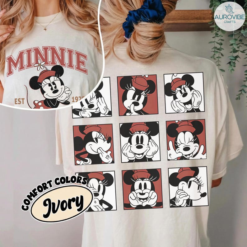 May include: Ivory-colored t-shirt featuring a Minnie Mouse design. The front displays "MINNIE" in red lettering with a Minnie Mouse graphic. The back showcases nine Minnie Mouse illustrations in red squares. The shirt also has the text "COMFORT COLORS" and "Ivory".