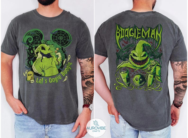 May include: A charcoal grey t-shirt featuring a green graphic of Oogie Boogie on the front with the text Let's Oogie Boogie and a larger green graphic on the back with the text BOOGIEMAN, showcasing a spooky character design with spiderwebs.