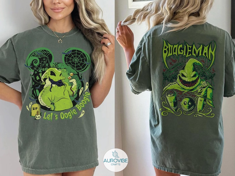 May include: A dark green t-shirt featuring a graphic of the character Oogie Boogie. The front displays the character with the text Let's Oogie Boogie. The back shows the character with the text BOOGIEMAN and other spooky themed illustrations.