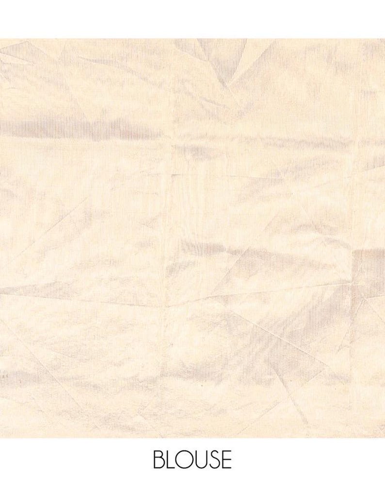 May include: A light beige fabric with a subtle, fine-ribbed texture and a series of intersecting, faint geometric lines creating a soft, creased appearance across the surface. The word BLOUSE is printed in a simple, black sans-serif font below.