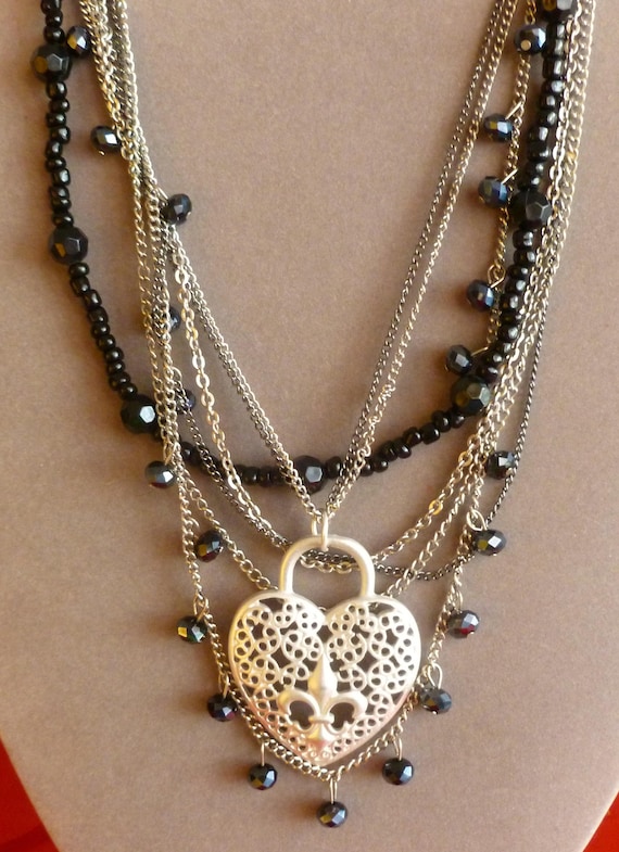 Multi Strand Necklace with Large, Fleur de Lis Pendant