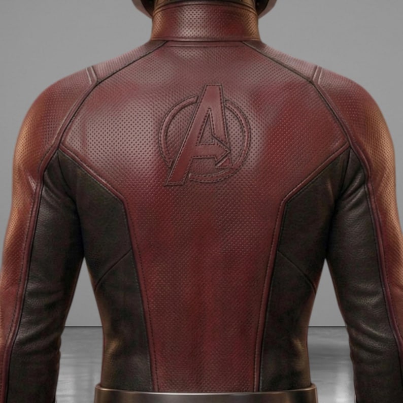 May include: A burgundy and black leather jacket with the Avengers logo embossed on the back. The burgundy leather has a perforated texture, and the jacket has a sleek, form-fitting design. The back of the jacket is the focal point, showcasing the iconic emblem.