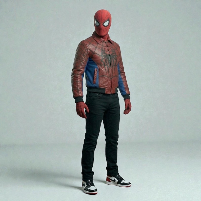 May include: A person wearing a red and blue Spider-Man costume, including a red mask, a red and blue leather jacket with a spider emblem, black jeans, and black and white sneakers with red accents.