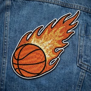 May include: A white ceramic mug with a black handle and the text "But First, Coffee" in a black, handwritten-style font. The mug is likely 4 inches tall and holds approximately 12 ounces of liquid.