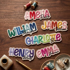 May include: Five custom embroidered name patches featuring colorful, puffy lettering with secondary names in black script. The names include Amelia Davis, William Thompson, James Wilson, Charlotte Brown, and Henry White, accompanied by sewing spools and a pen.