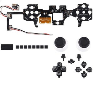 May include: A disassembled black game controller with various components. Includes a circuit board, joysticks, buttons, and other parts. The text "eXtremeRate" is visible on the circuit board. The components are arranged on a white background.