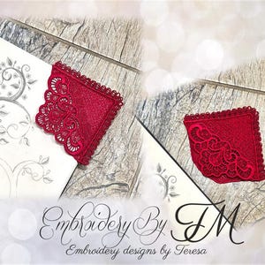 May include: Two red embroidered lace appliques with detailed floral patterns. The appliques are square with scalloped edges. The image also shows a sketch of a tree and the text "Embroidery By TM, Embroidery designs by Teresa."