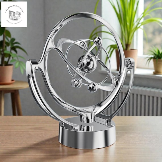 A handcrafted perpetual-motion kinetic desk sculpture that looks like it belongs on a Bond villain's desk — mesmerizing, tactile, and genuinely conversation-starting.