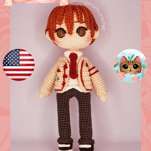 May include: A crocheted doll with red hair, brown eyes, and a cream-colored outfit with a red tie. The doll is wearing brown pants and black shoes. Text at the top reads "PDF PATTERN - ATSUSHI OTANI - BY KITSUGURUMI CROCHET".