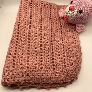 Baby and toddler blanket made with the openwork crochet technique