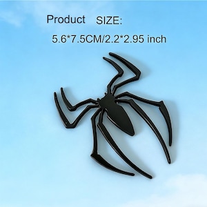 May include: A black spider-shaped decorative item with long, pointed legs. The product size is 2.2 x 2.95 inches. The item is set against a light blue background. The text "Product SIZE:" is visible at the top.